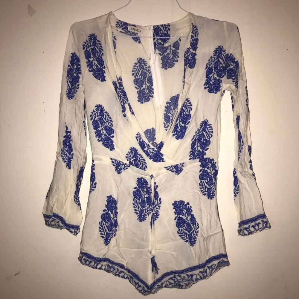 Deep V blue and white romper with feather pattern